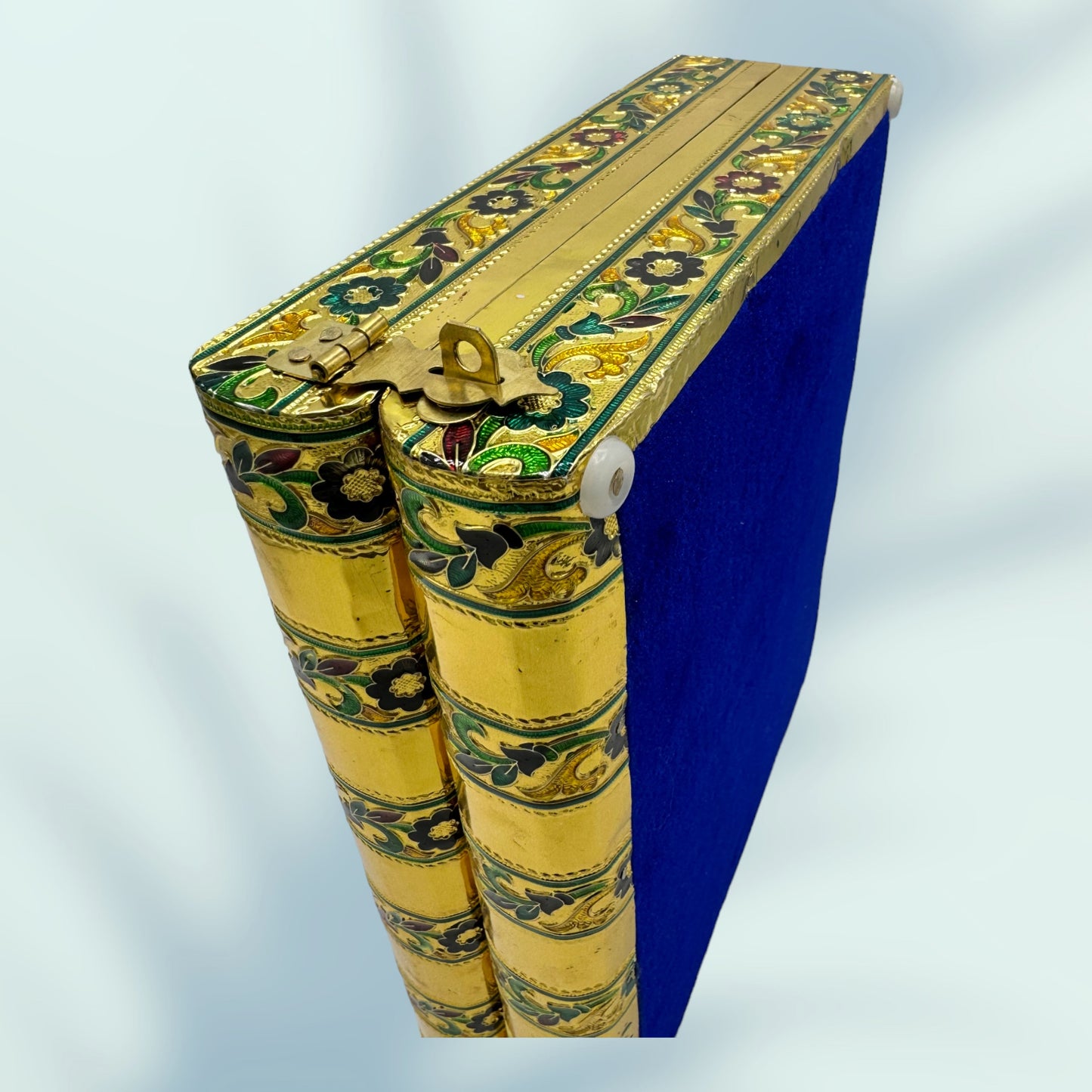 regal peacock meenakari jewelry box has velvet lining on the bottom surface shown here in royal blue