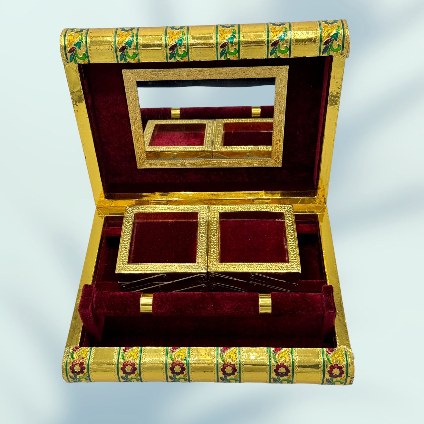 royal meenakari peacock box comes in a maroon red velvet lining as shown in this image 