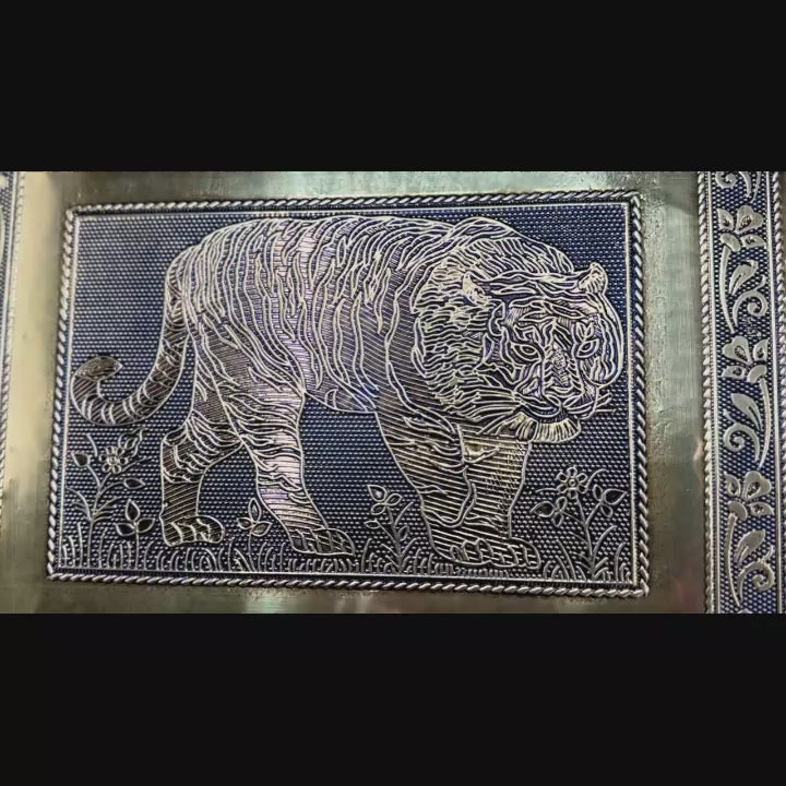 Video of handmade Indian tiger jewelry box with red lining, shows both color options at end 