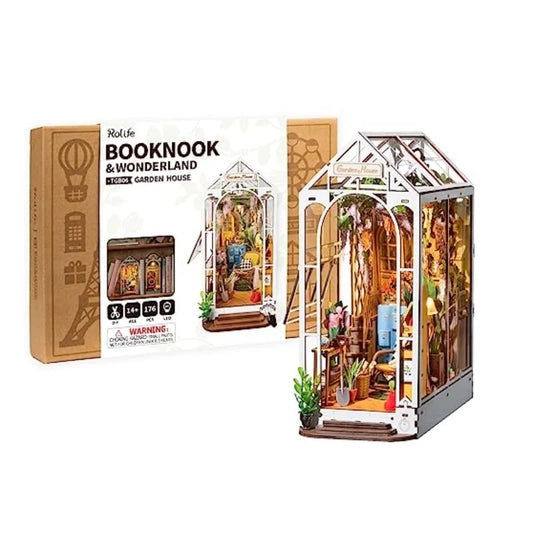 Model of a miniature garden house with packaging labeled 'Booknook & Wonderland' on a white background.