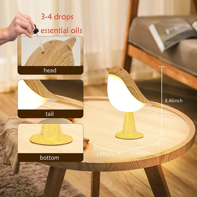 Bird-shaped night light on a table with instructions for using essential oils.