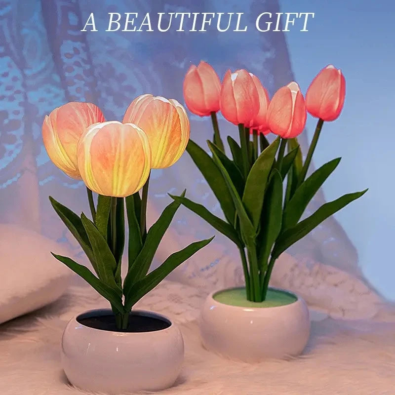 Two tulip table night lights with glowing flowers on a soft surface with 'A Beautiful Gift' text.
